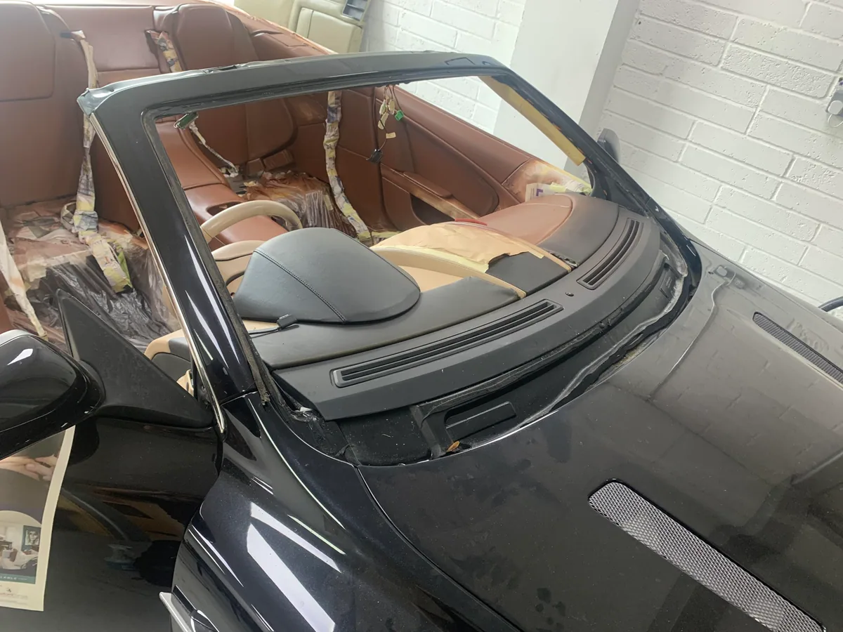 Aston Martin DB9 windscreen aperture after the old urethane is removed.