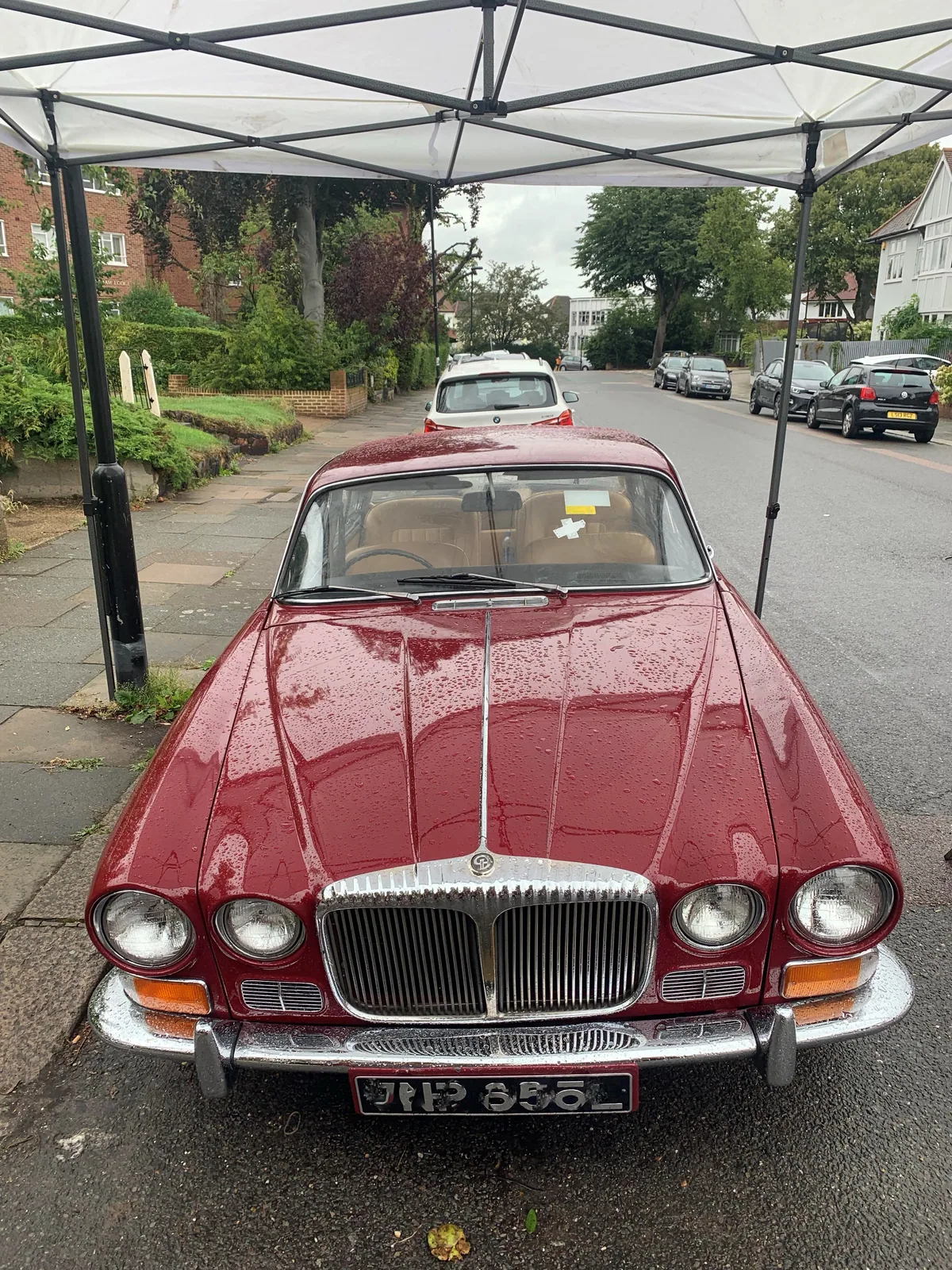 Classic Jaguar XJ6 outdoors during a mobile windscreen replacement.