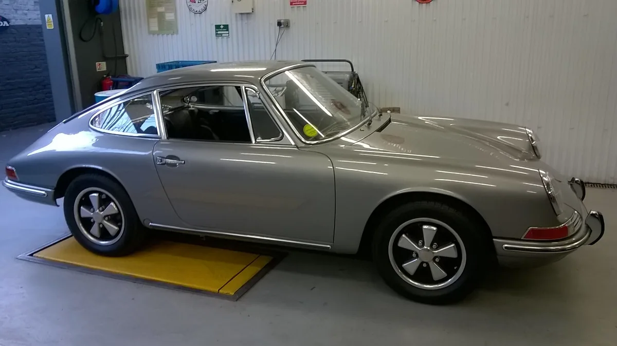 Classic Porsche during windscreen and rear window replacement.
