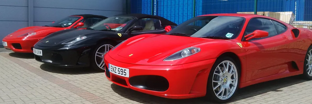 Red Ferrari photographed outdoors after a mobile windscreen job.
