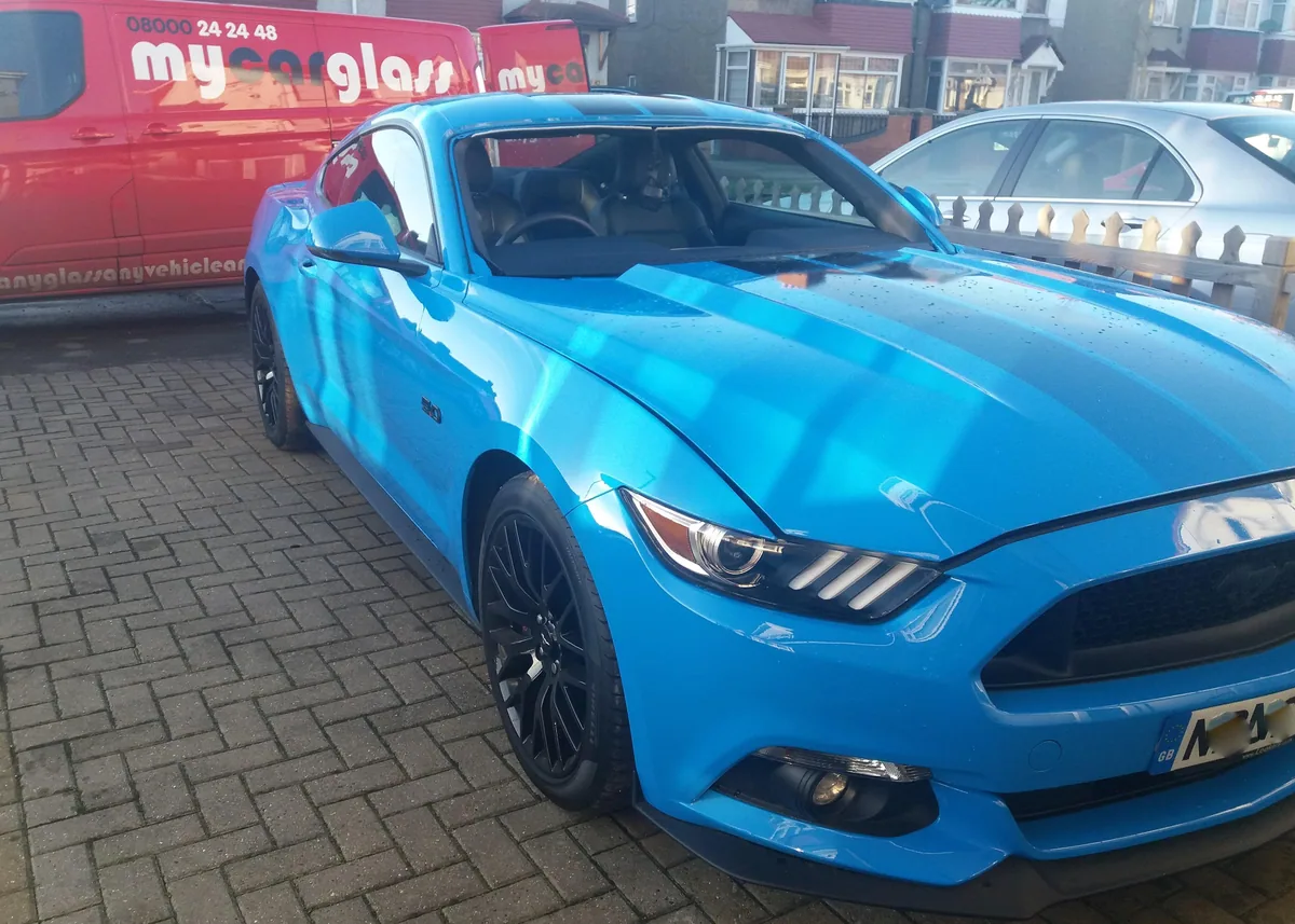 Blue Ford Mustang prepared for windscreen replacement.