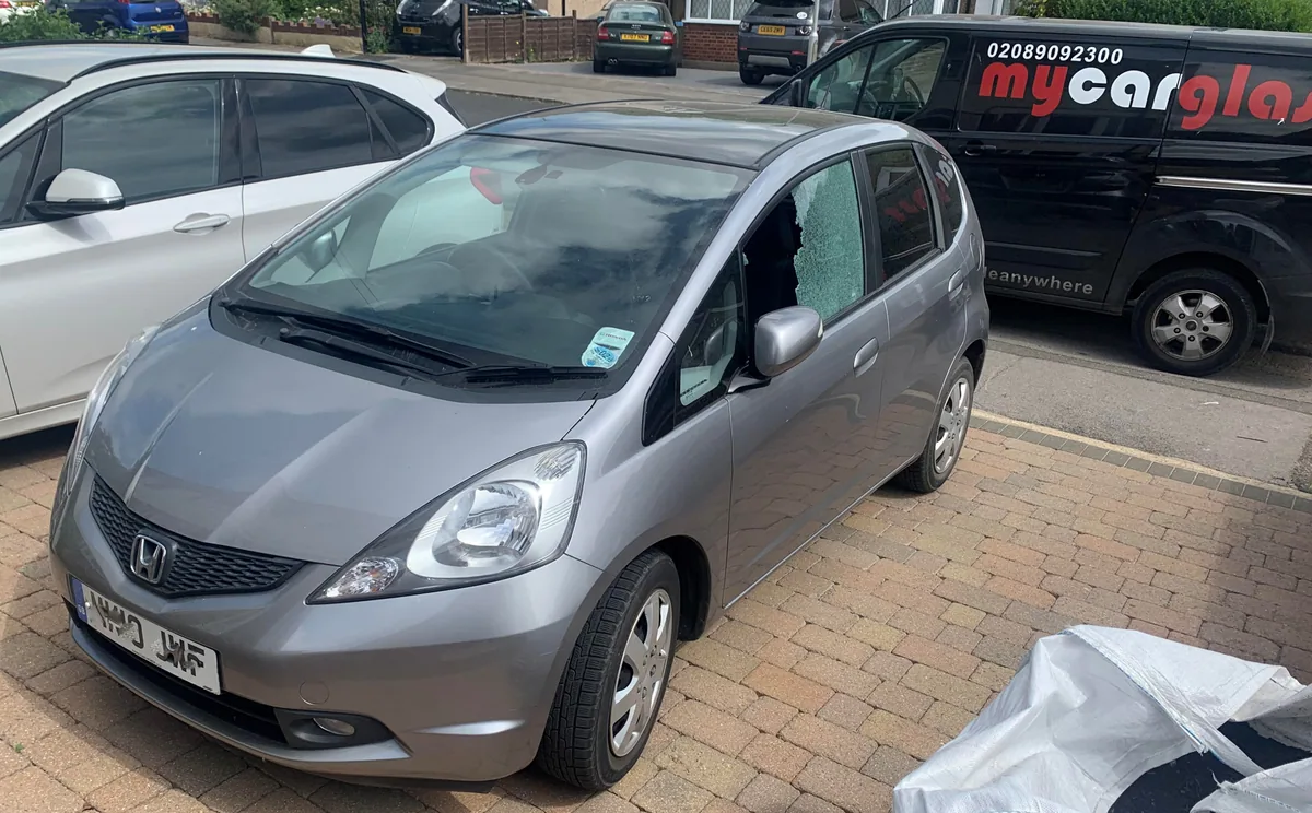 Honda Jazz during door glass replacement after damage.