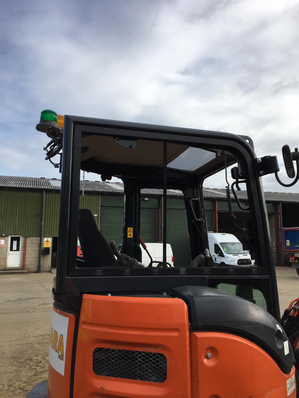 JCB plant machinery cab glass replacement on site.