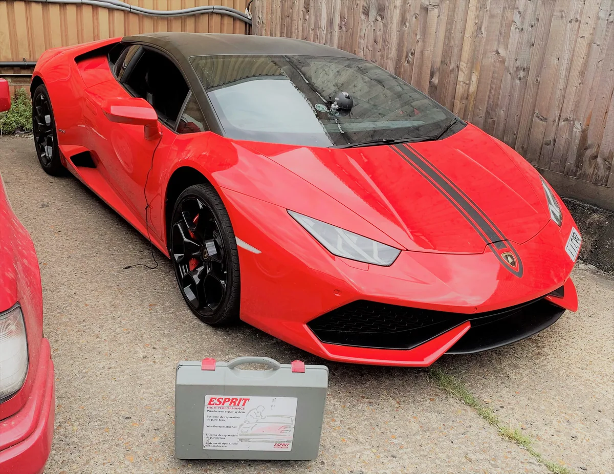 Stone chip on the windscreen of a Lamborghini Huracán before resin repair.