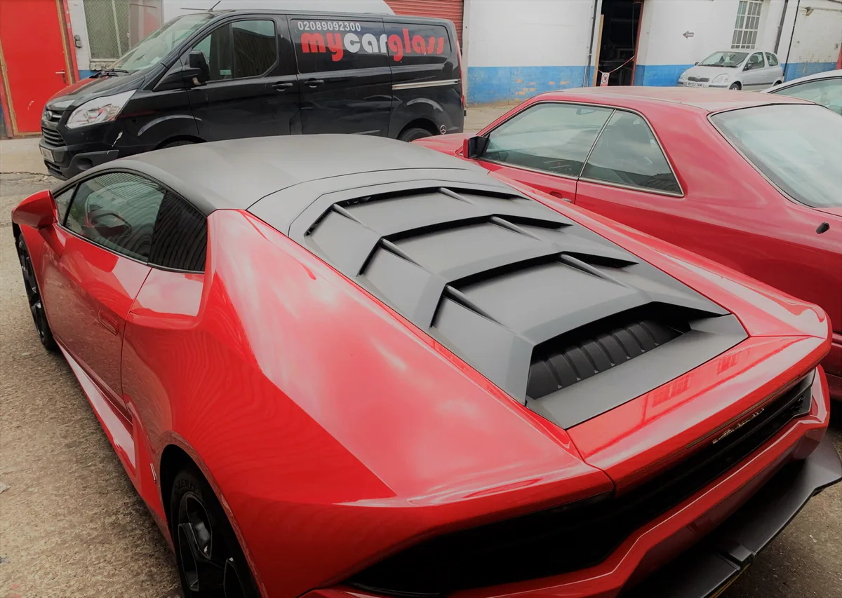 Resin being injected into the windscreen chip on a Lamborghini Huracán.