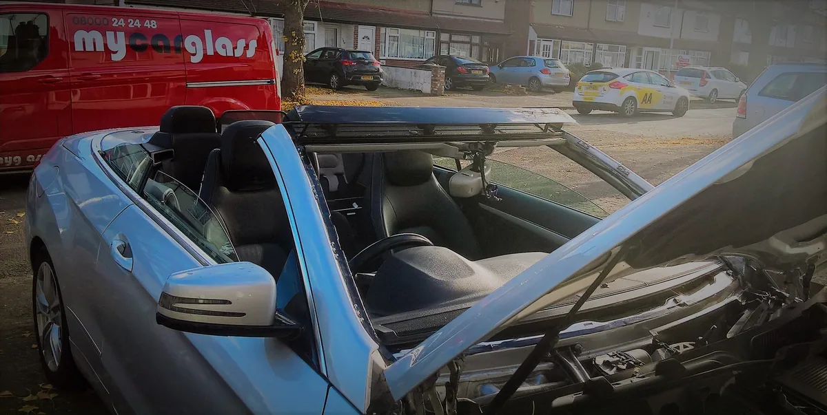 Mercedes E-Class Cabriolet during windscreen replacement.