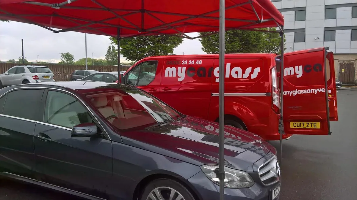 Mercedes E-Class alongside the MyCarGlass van on a mobile callout.
