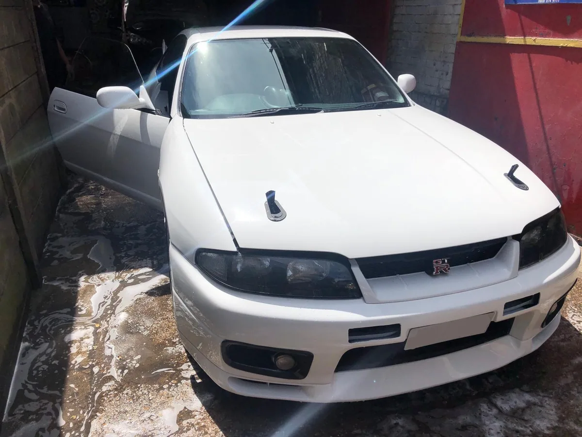Classic Nissan Skyline with the windscreen refitted.
