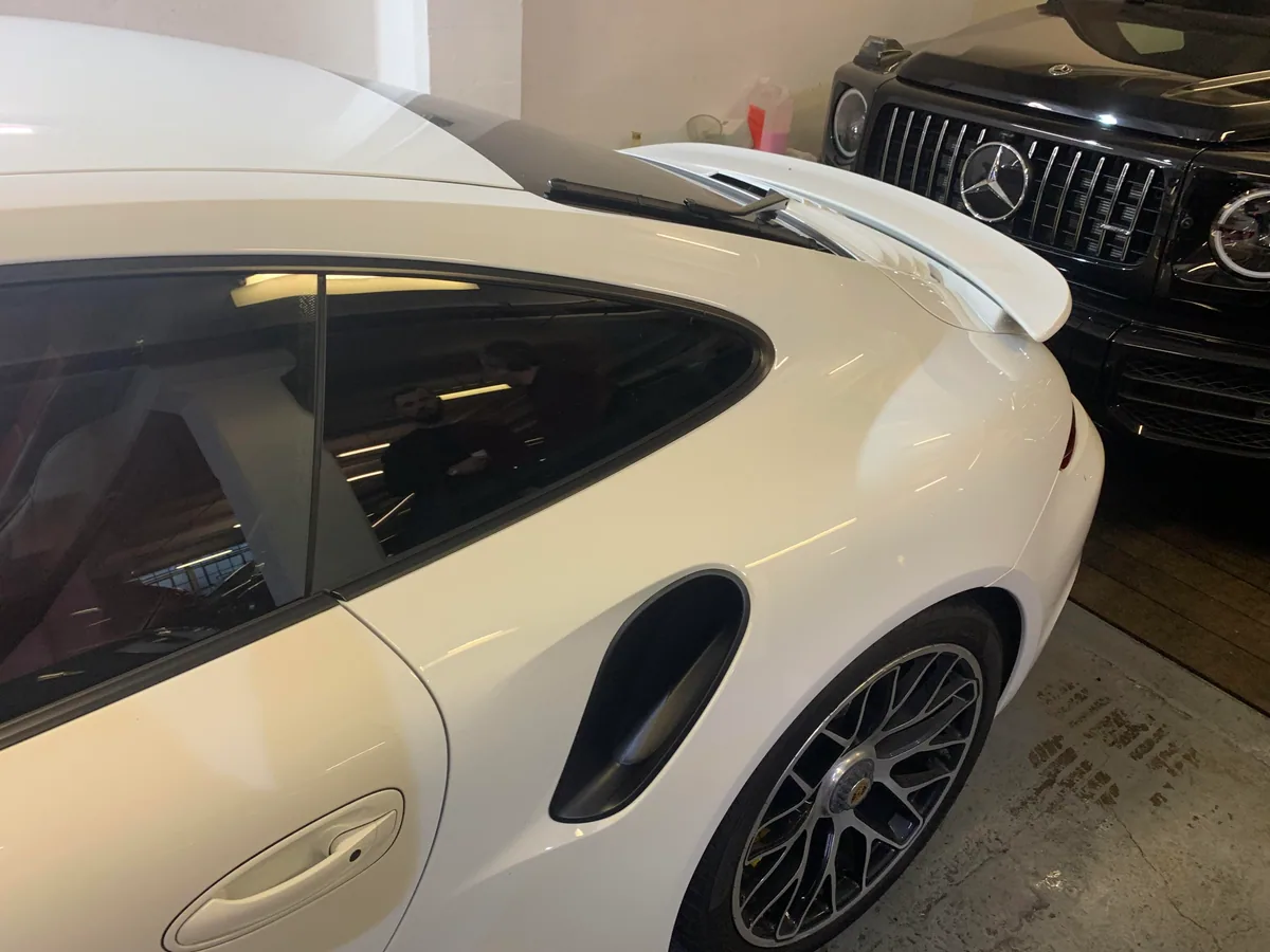 Porsche 911 quarter glass aperture cleaned and prepared.