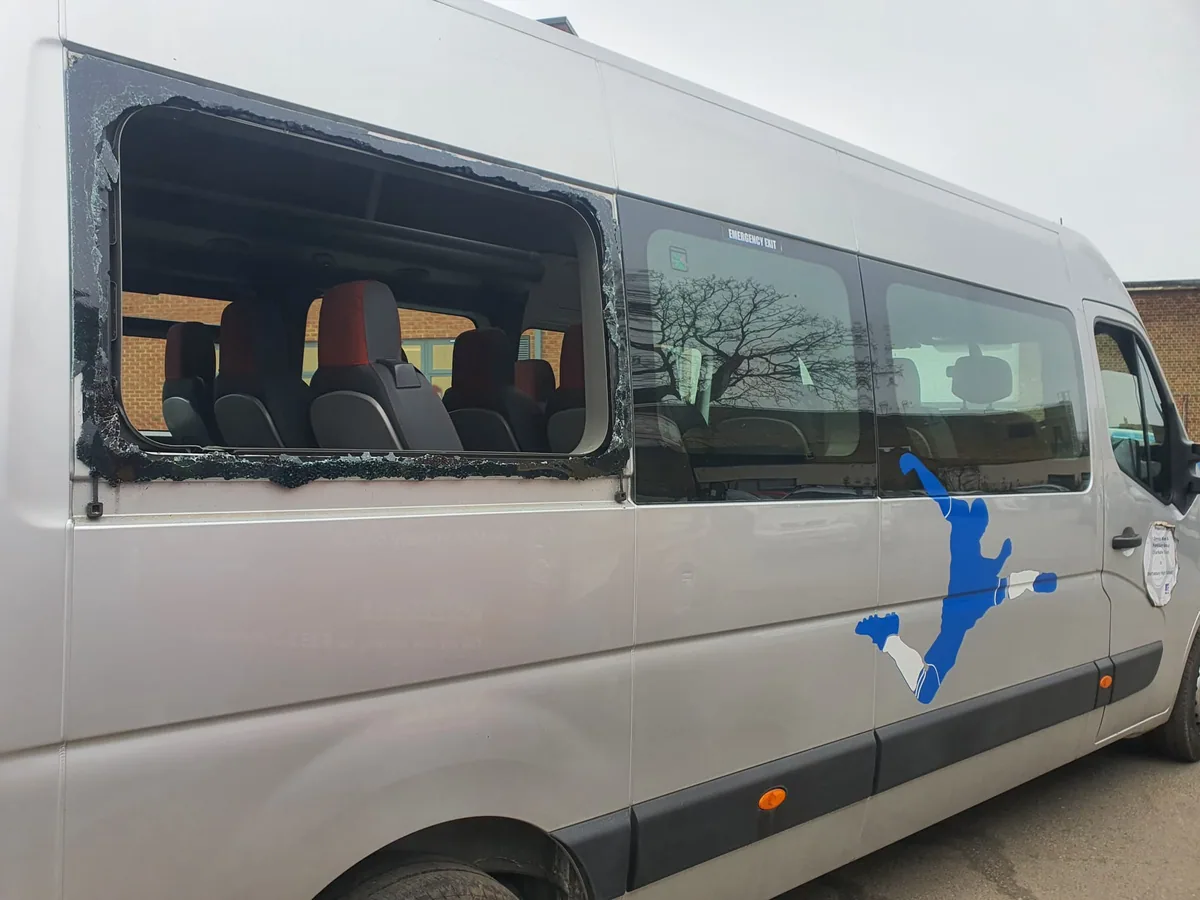 Renault Master minibus during side window replacement.