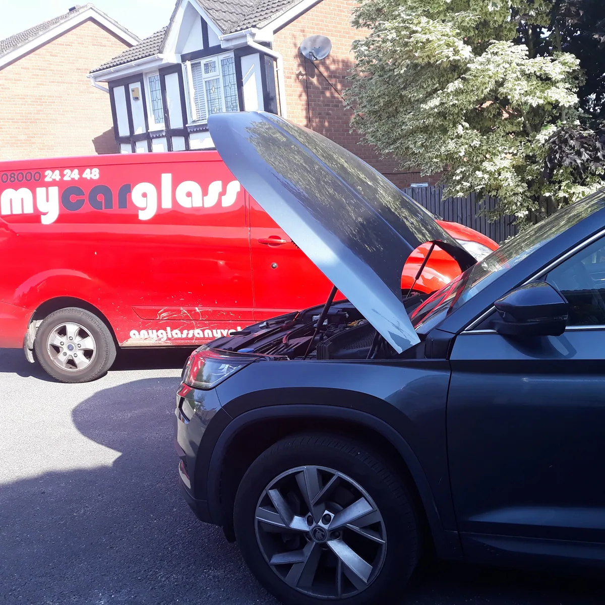 Skoda Kodiaq SUV during windscreen replacement at the workshop.