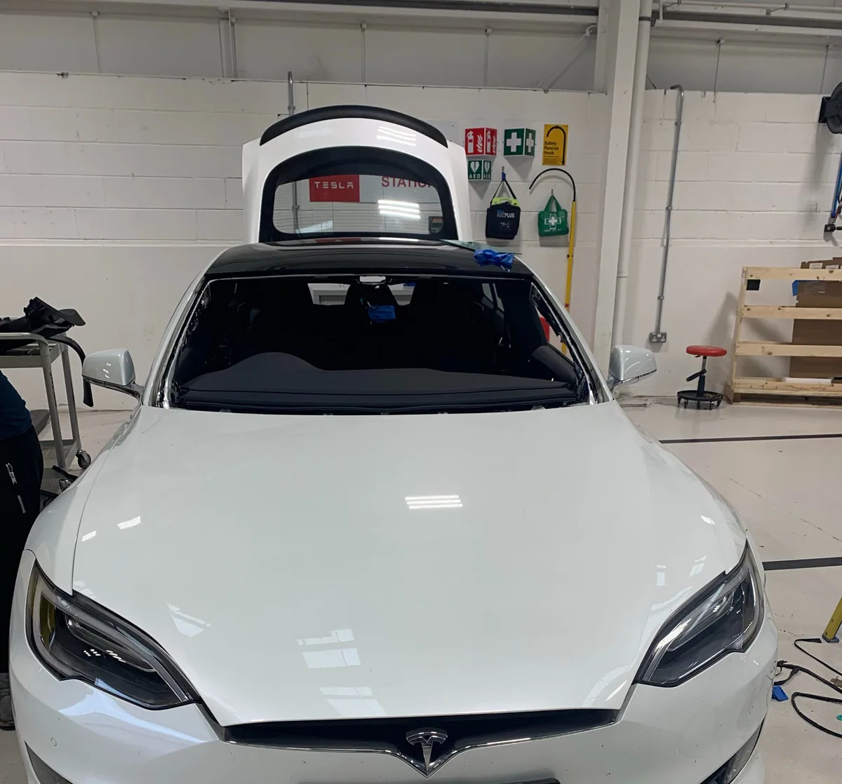 Tesla Model S at a service centre for windscreen work.