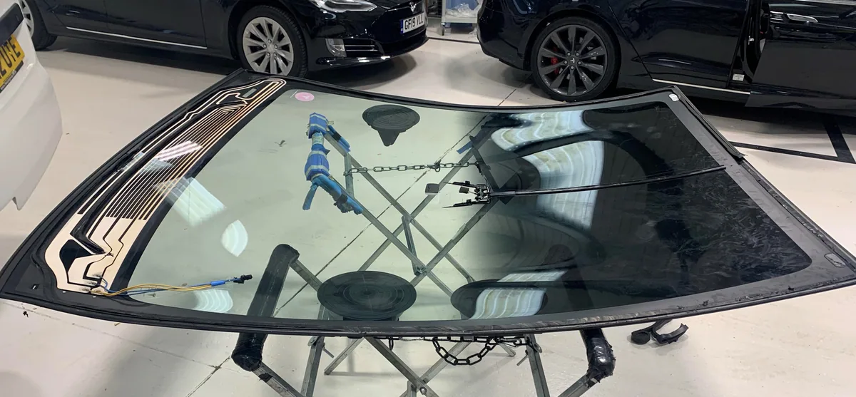 Close-up of the Autopilot camera mount behind the Tesla Model X windscreen.
