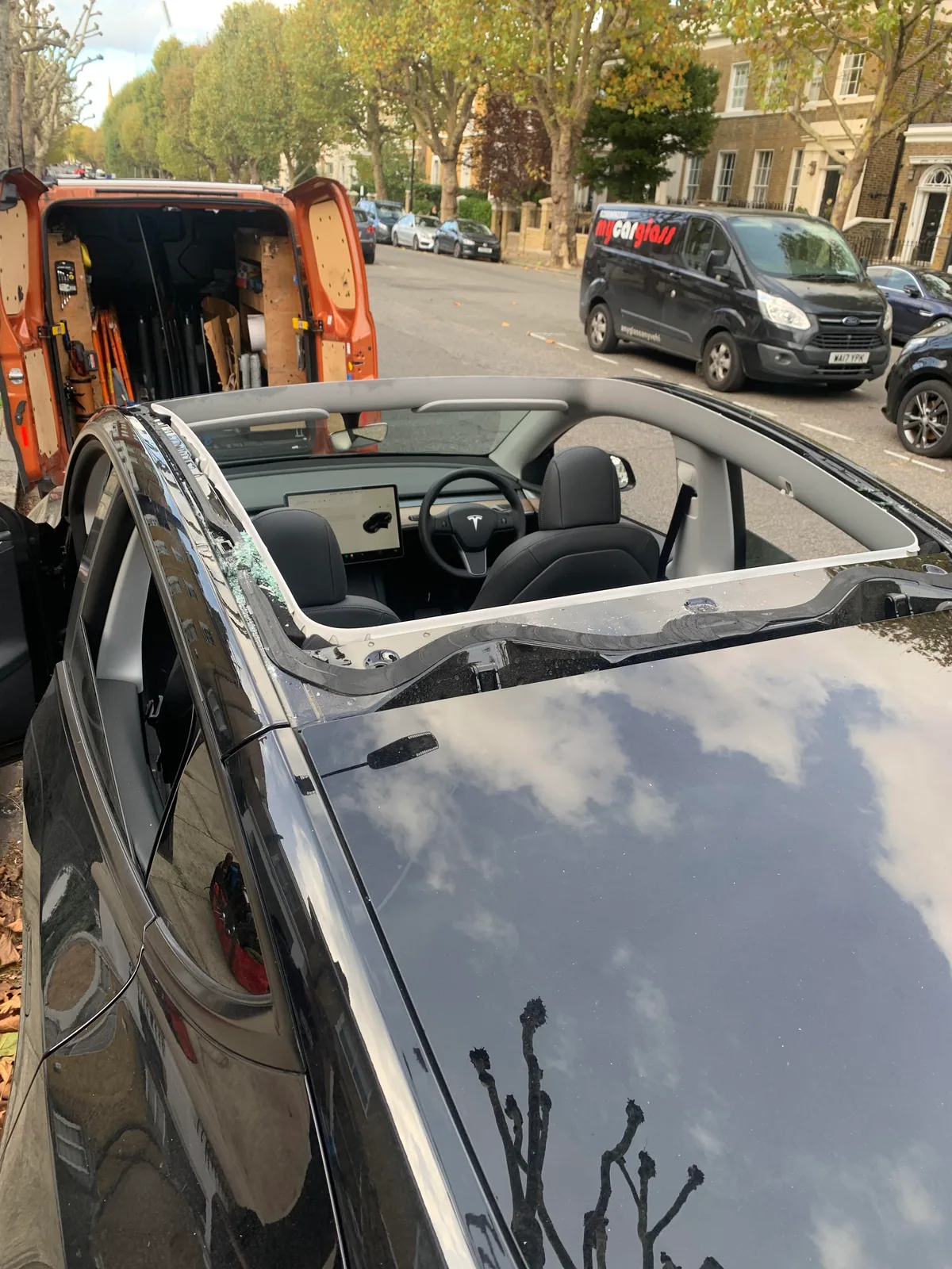 Tesla Model Y after roof glass damage, before emergency replacement.