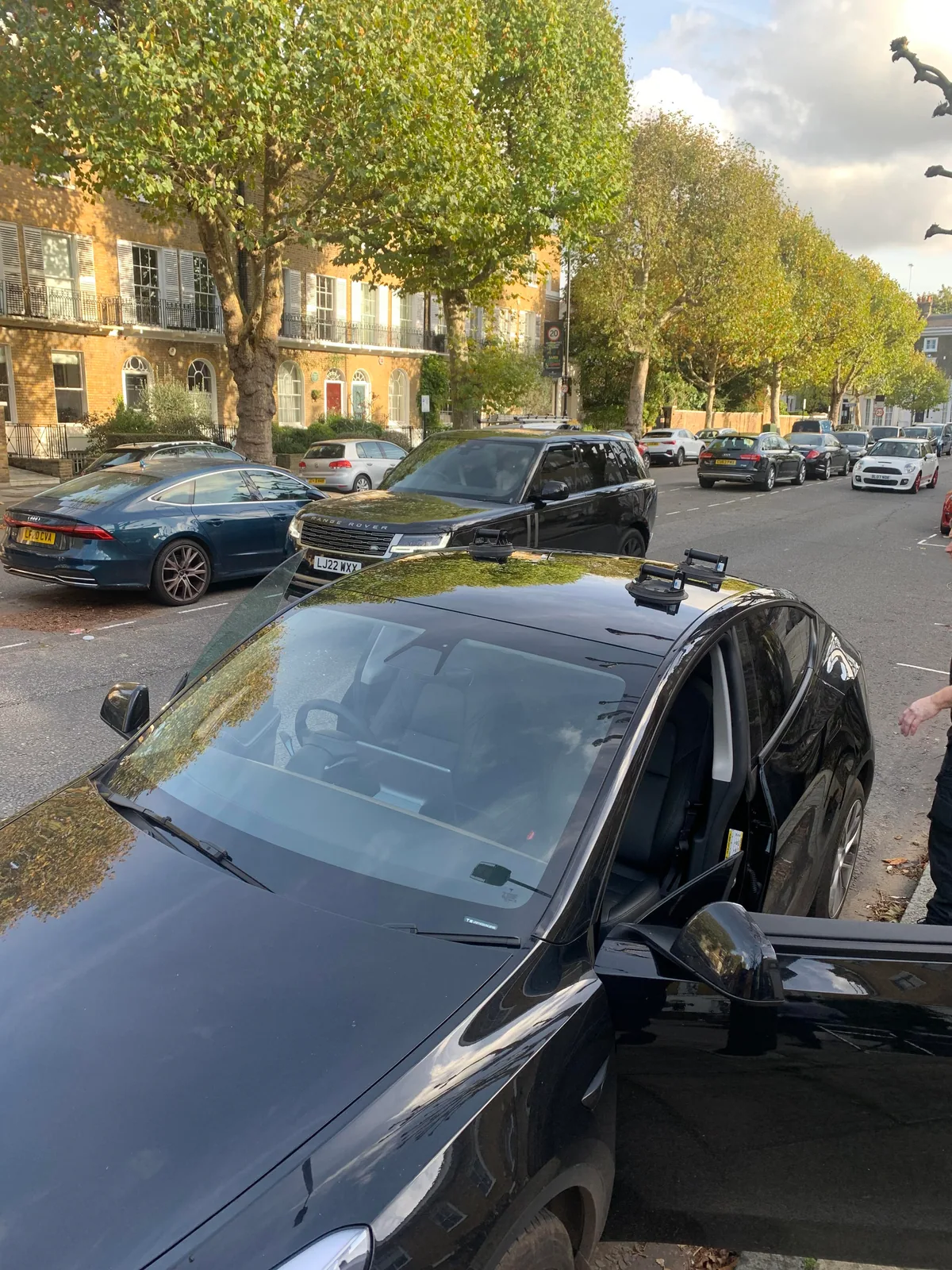 Tesla Model Y roof glass replacement in progress on site.