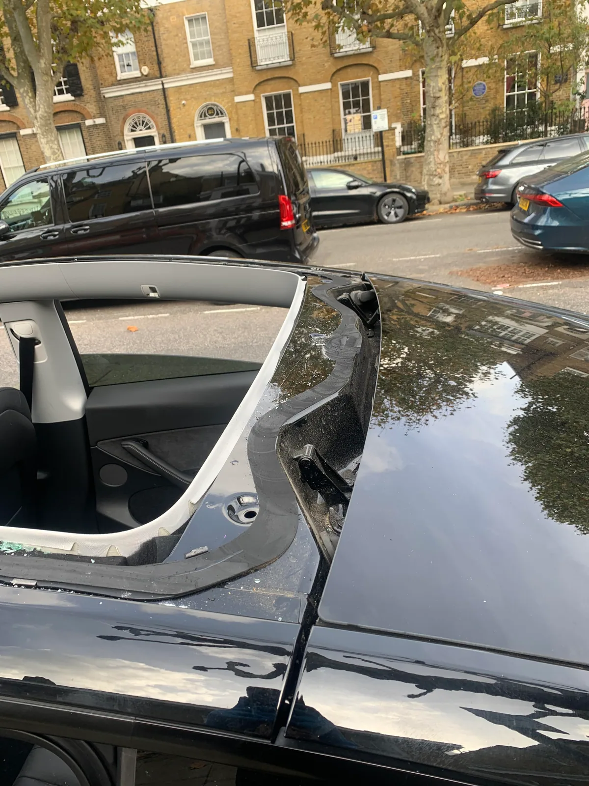 Tesla Model Y with vandalised roof glass before replacement.